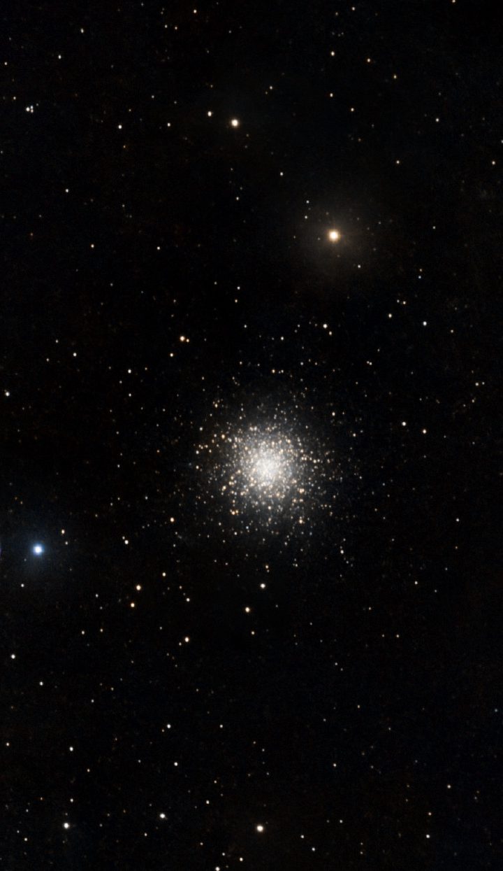 Astrophotograph of M13, the Great Globular Cluster in Hercules, a dense spherical swarm of tens of thousands of stars