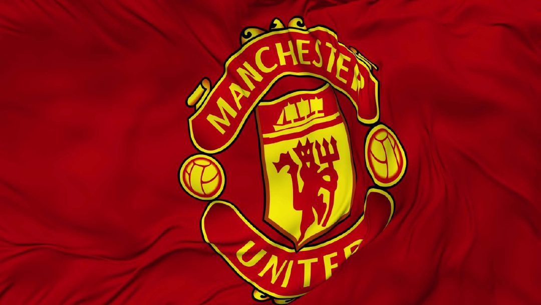 Manchester United crest on a waving red flag